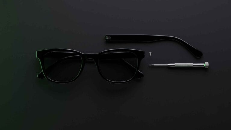 How to Replace Temple Arms on Sunglasses or Eyeglasses 2 Detached temple arm beside a sunglasses frame and a precision screwdriver on a dark surface